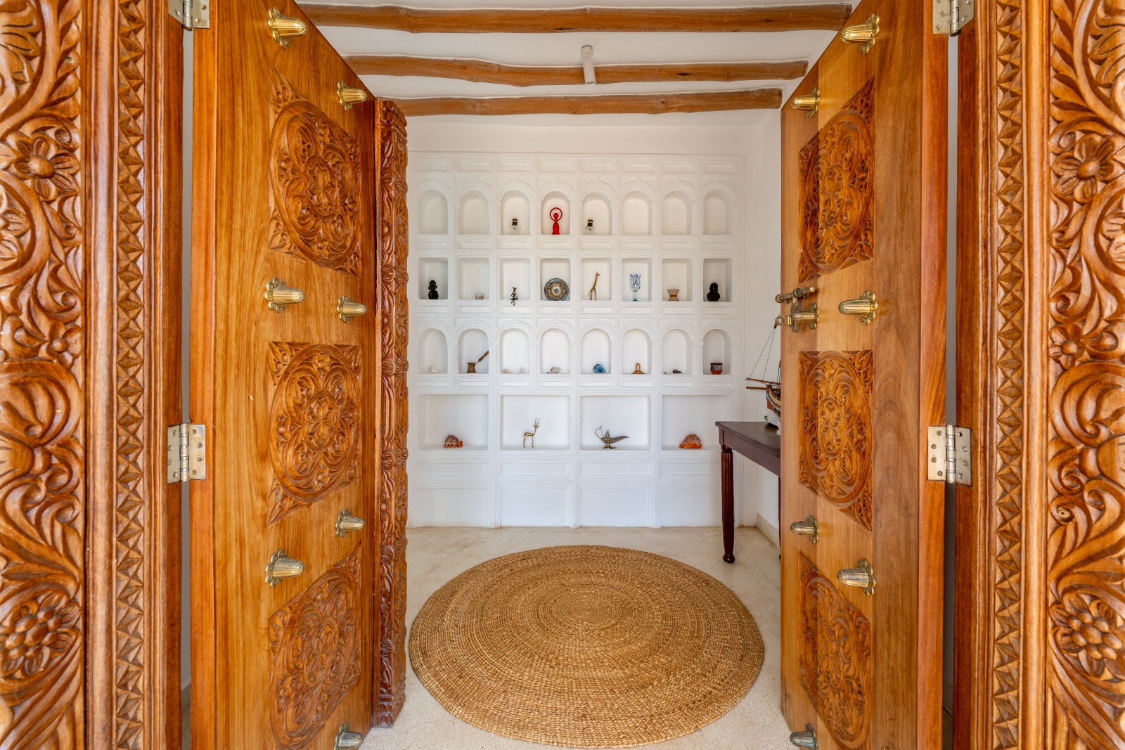 Carved wooden entrance doors at Casa Blanca Villa